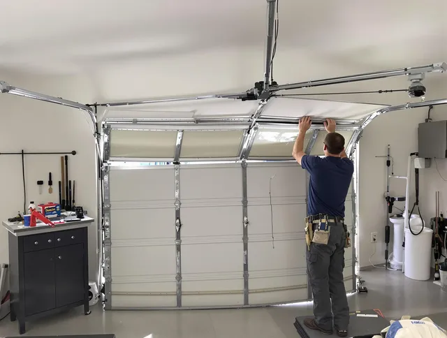 Pataskala Garage Door Repair specialist performing precise section replacement on Pataskala garage door